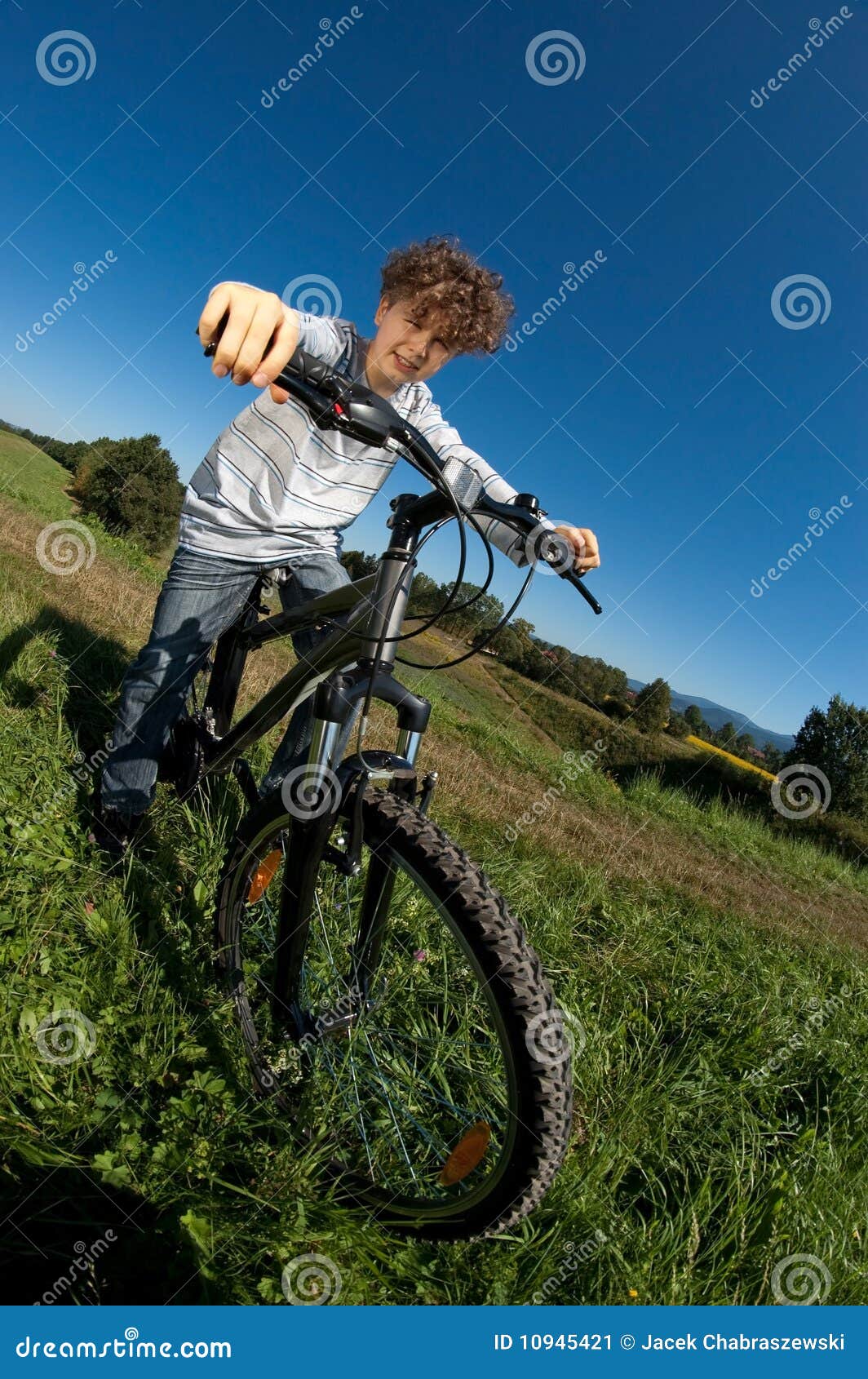 Young boy cycling stock image. Image of countryside, angle - 10945421