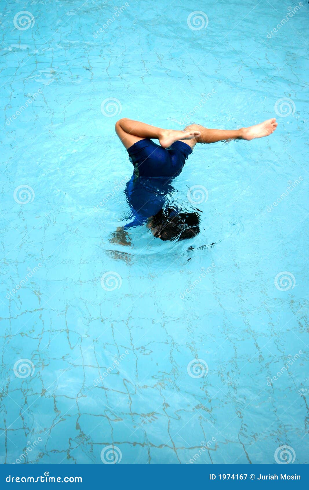 A Young Boy Doing a Somersault in the Swimming Pool Stock Image Image