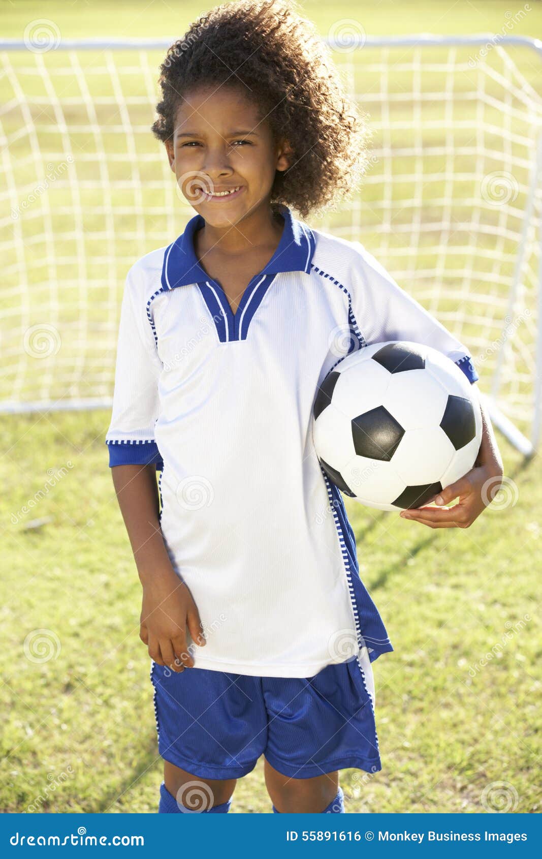 Young Boy Dressed in Soccer Kit Standing by Goal Stock Photo - Image of ...