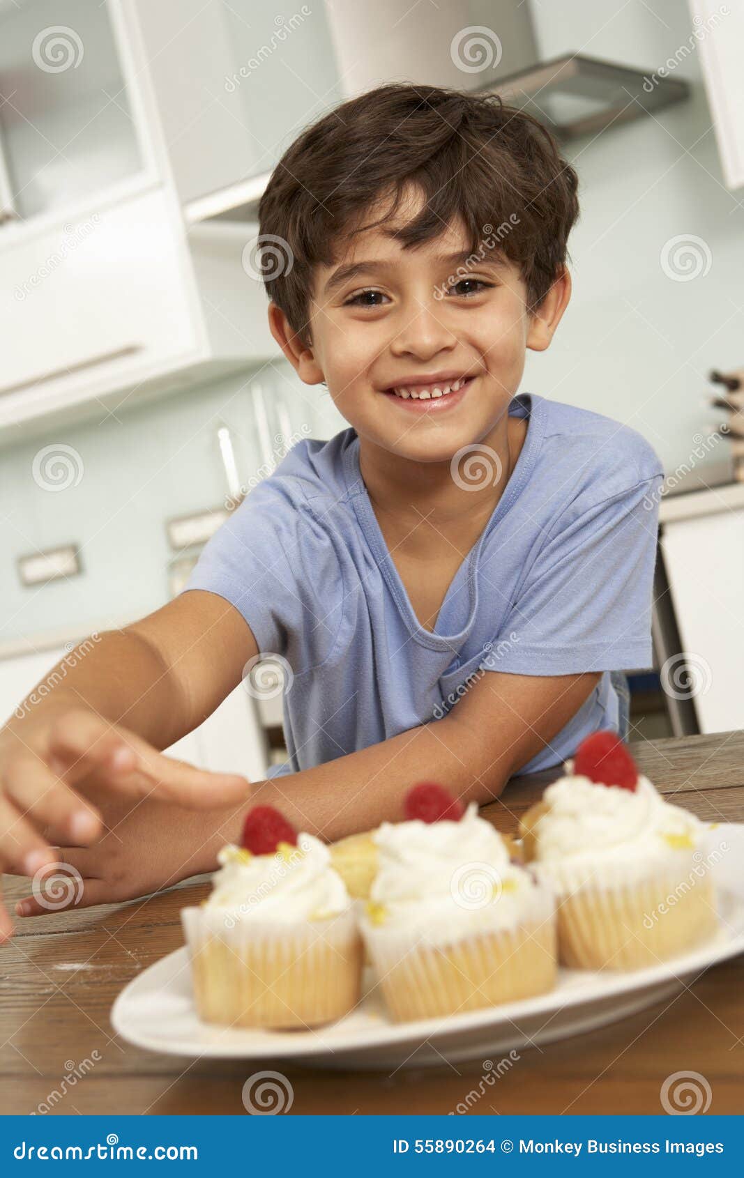 Young Boy Eating Cakes in Kitchen Stock Photo Image of food, vertical