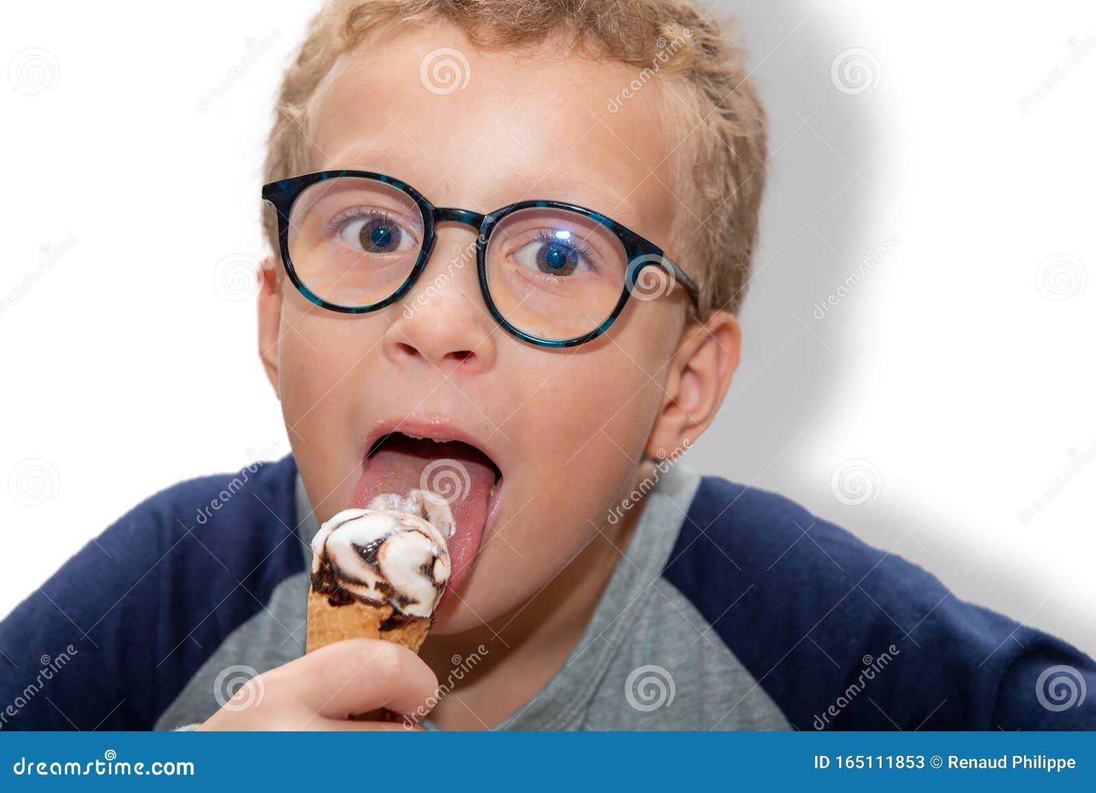 Young Boy with Eyeglasses Eating Ice Cream Stock Image Image of child, happiness 165111853
