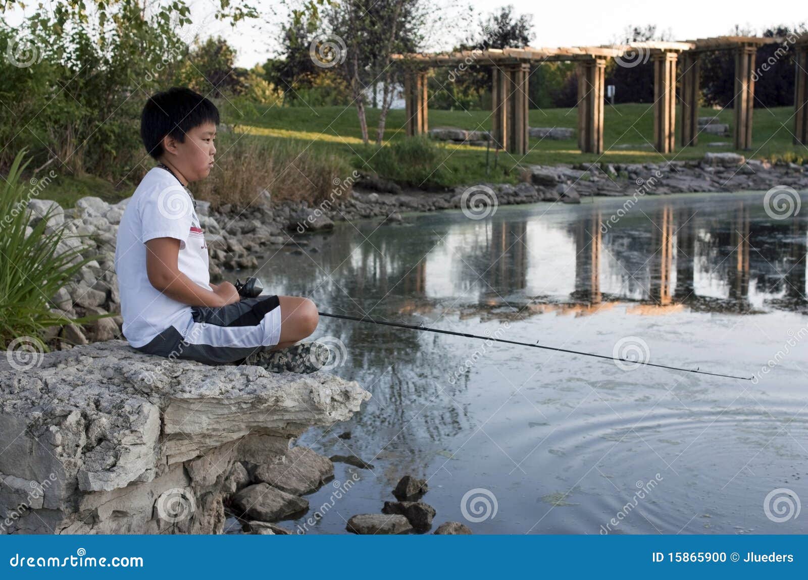 Boy Fishing Sitting Rock Stock Photos - Free & Royalty-Free Stock
