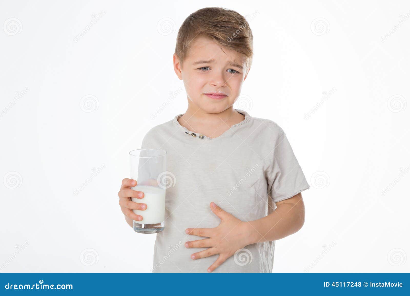 Young boy has a bellyache stock photo. Image of expression 45117248