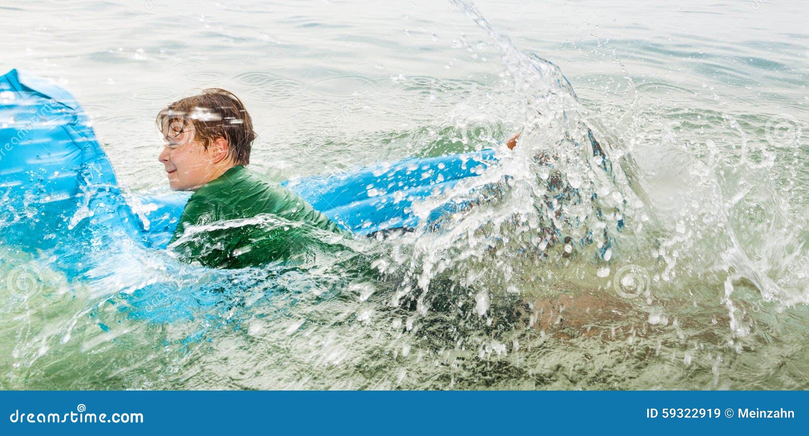 Young Boy Has Fun Jumping on an Air Mattress Stock Image Image of
