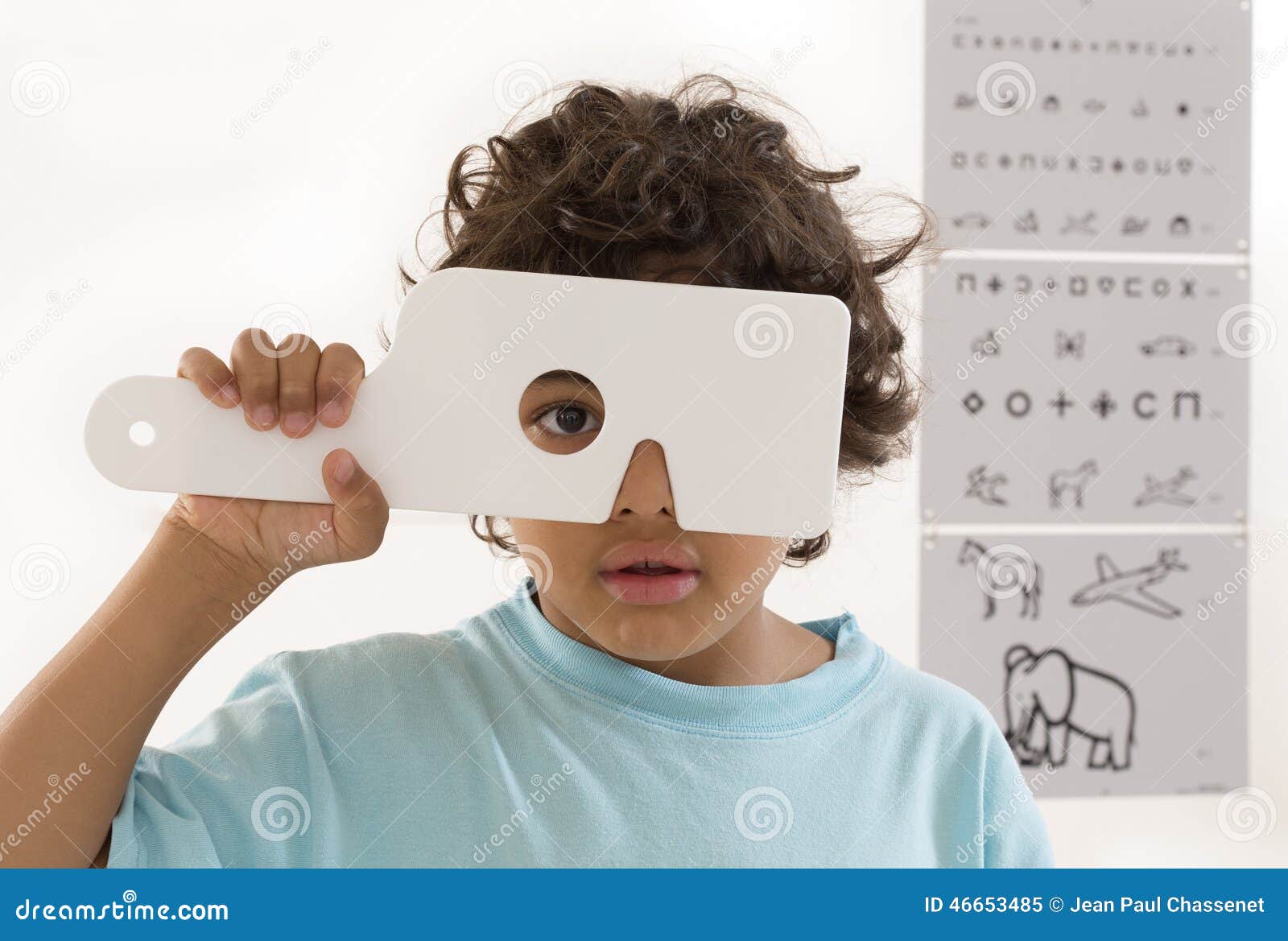 young boy is having eye exam