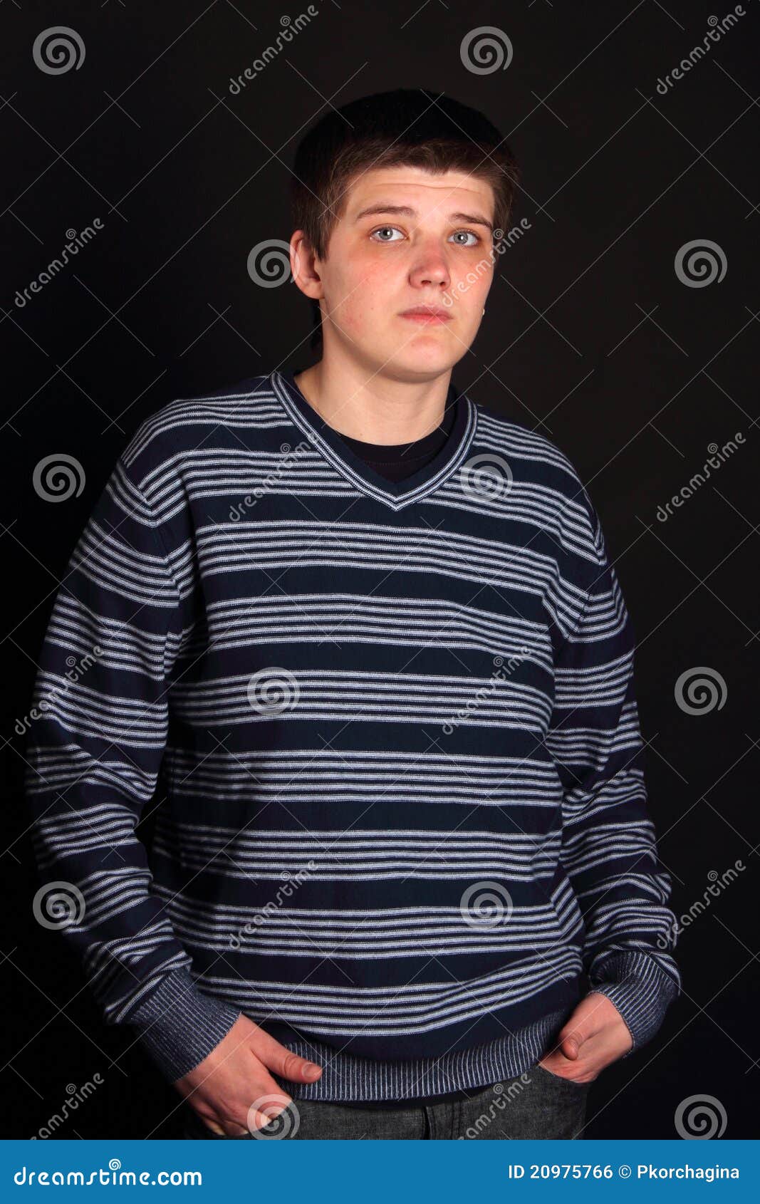 A Young Boy With His Hands In Pockets Stock Photo Image of sweater