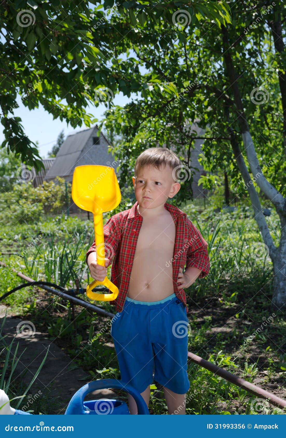 Young Boy with His Spade in the Garden Stock Photo - Image of ...