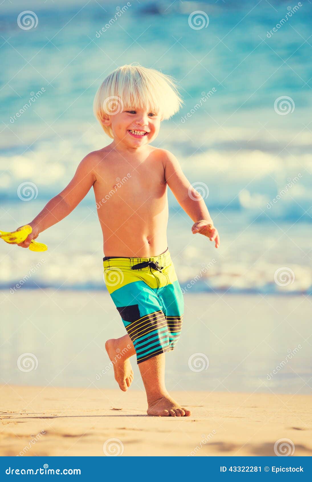 Young Boy Playing at the Beach Stock Image - Image of leisure