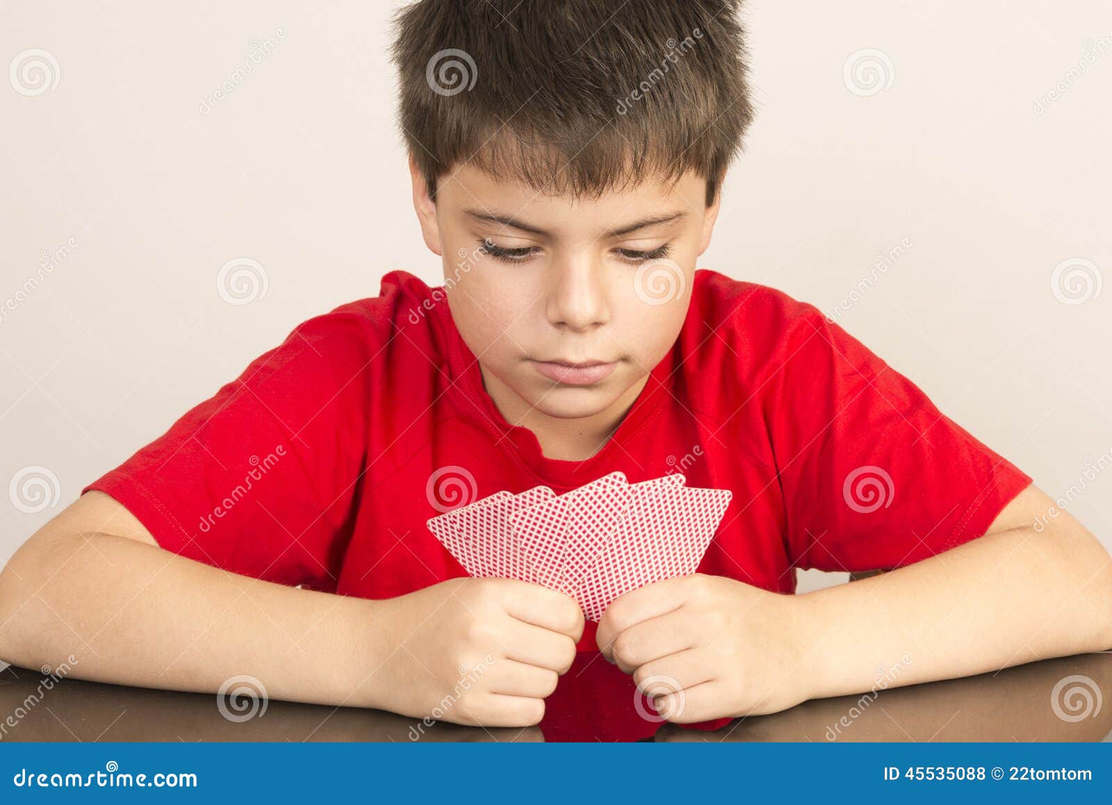 Young boy playing cards stock photo. Image of hobbies 45535088