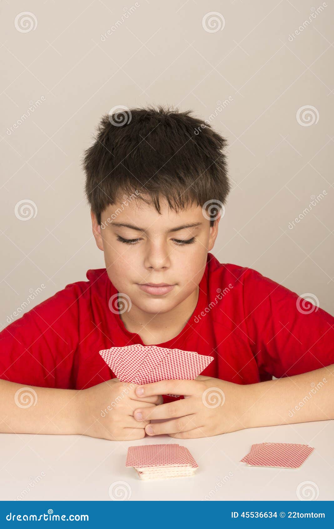 Young boy playing cards stock photo. Image of close, casual 45536634