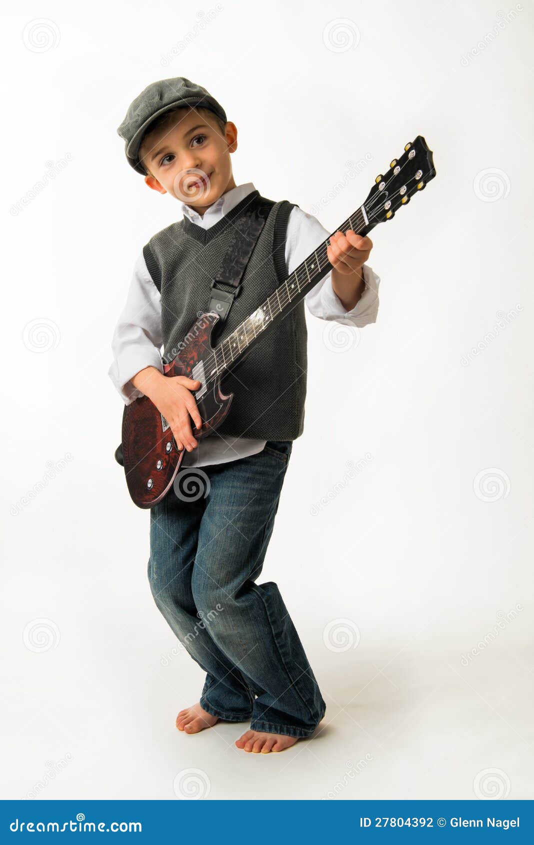 Young boy playing guitar stock photo. Image of indoors 27804392