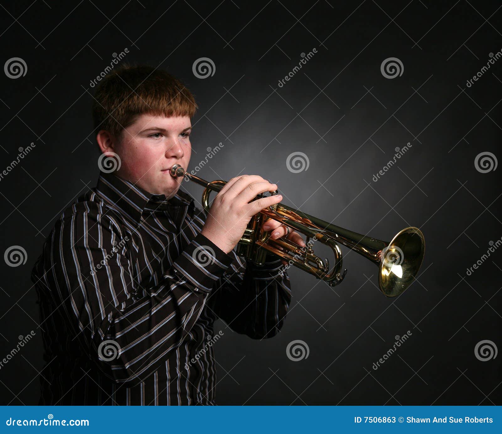 Young boy playing trumpet stock image. Image of brass 7506863