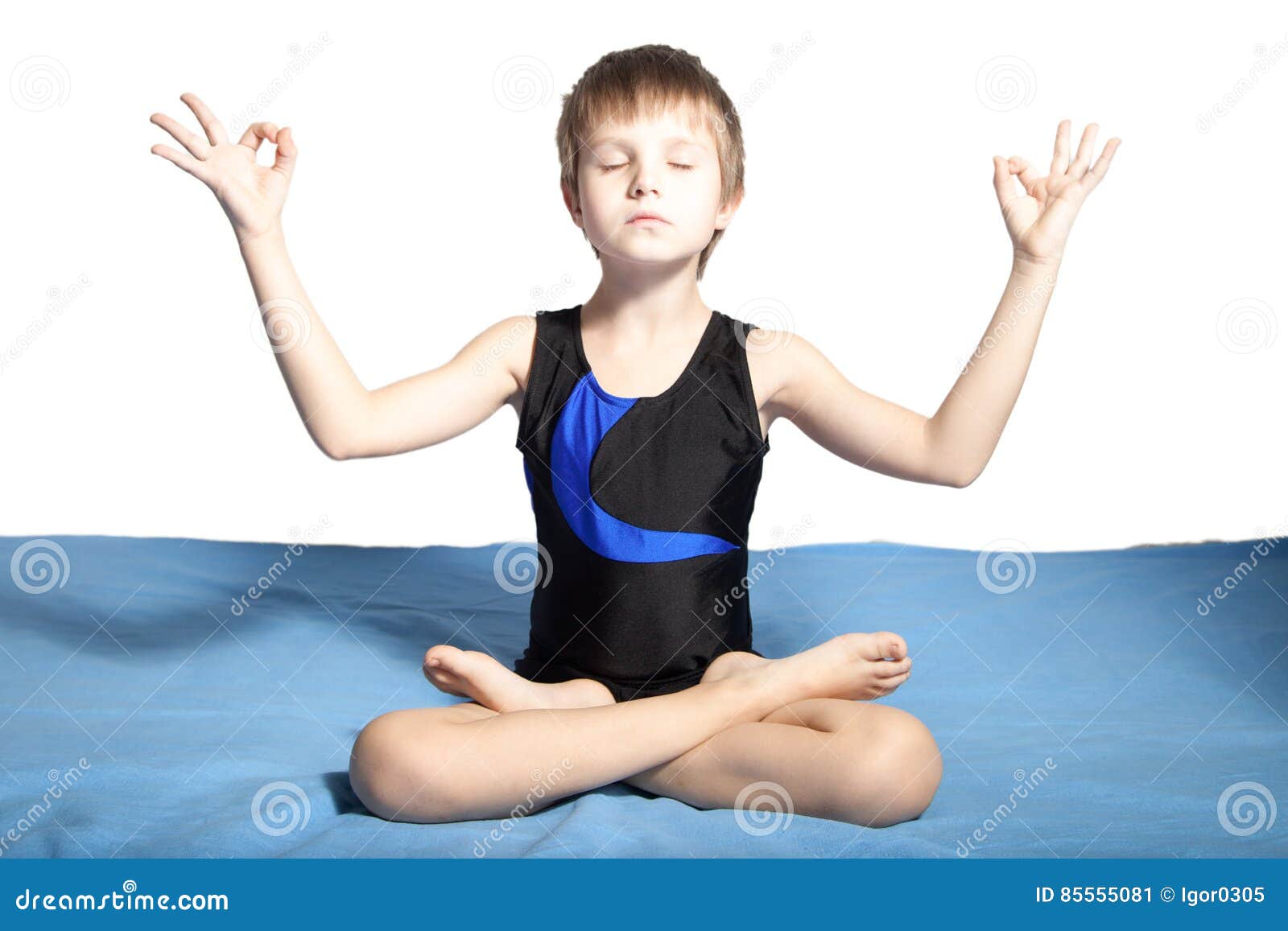 Young boy practices yoga stock image. Image of cute, relaxation 85555081