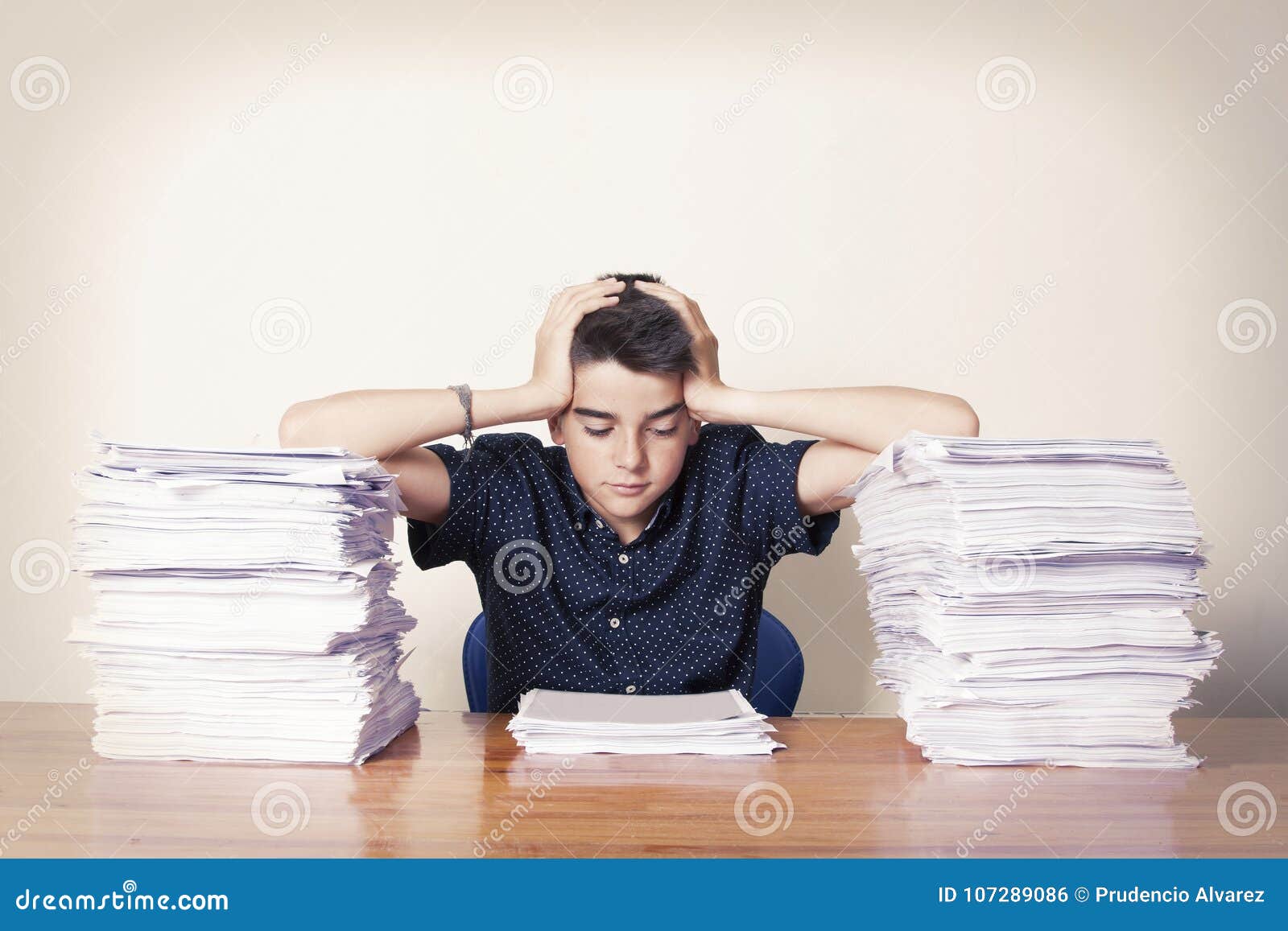 Young Boy With Piles Of Papers Stock Photo Image Of Desk