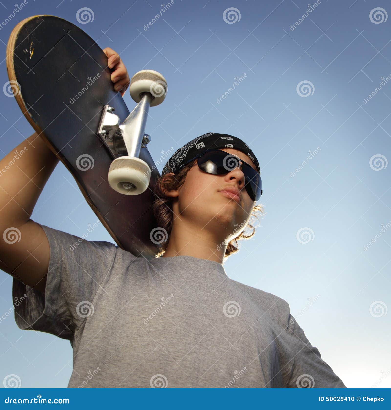 Young Boy with Skateboard in Hand Stock Photo - Image of shirt, male ...