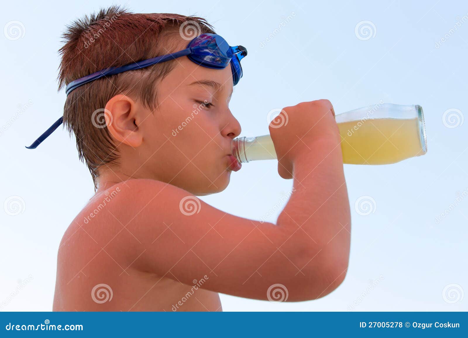 young boy slaking his thirst
