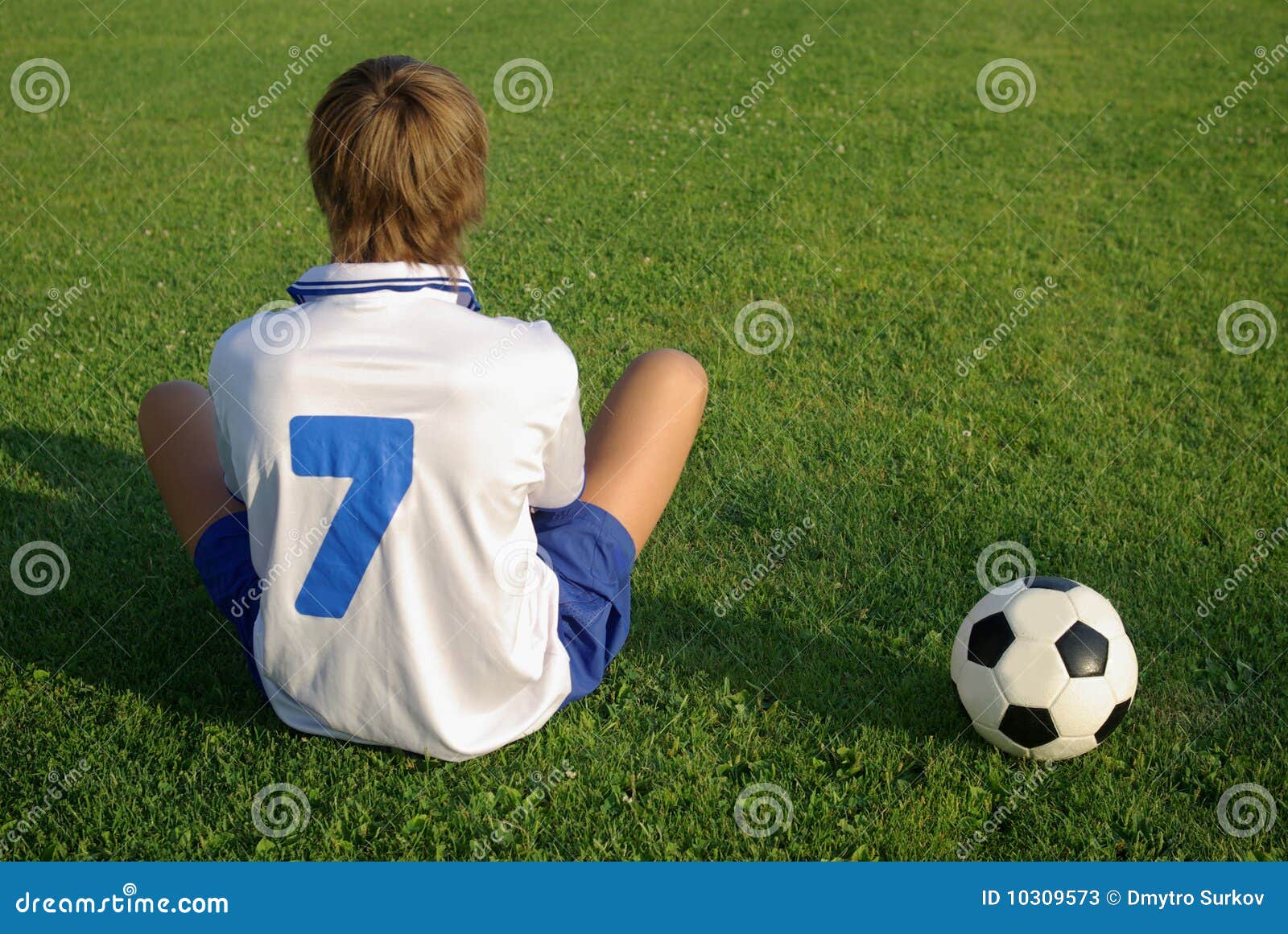 A Young Boy with a Soccer Ball Stock Image Image of lying, boys 10309573