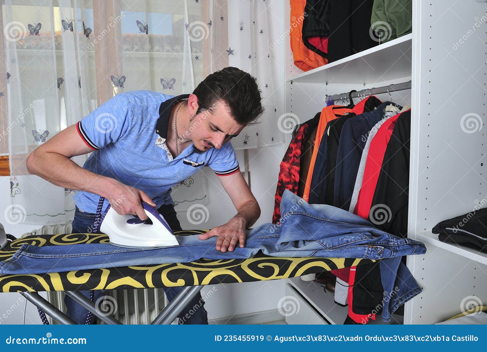 Young Boy Steam Ironing Some Jeans. Stock Image Image of cleaning