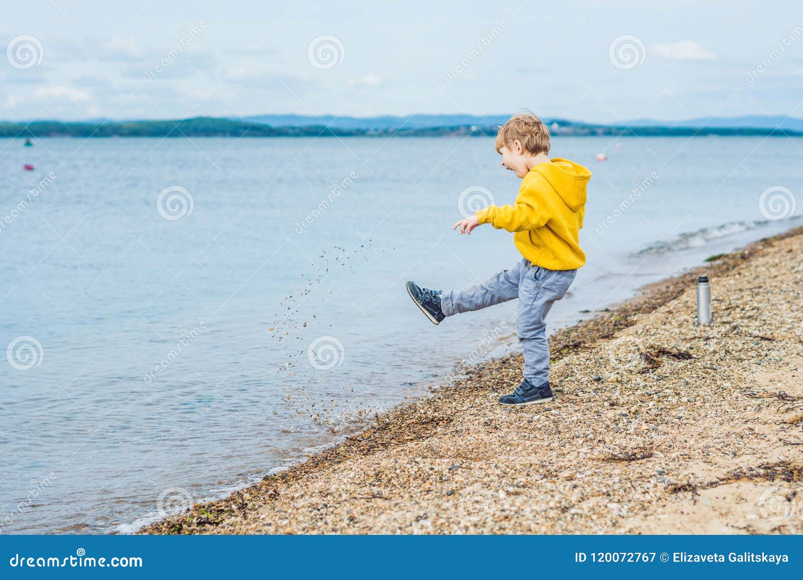 Young Boy Throwing Stones in Sea Water Stock Image Image of leisure