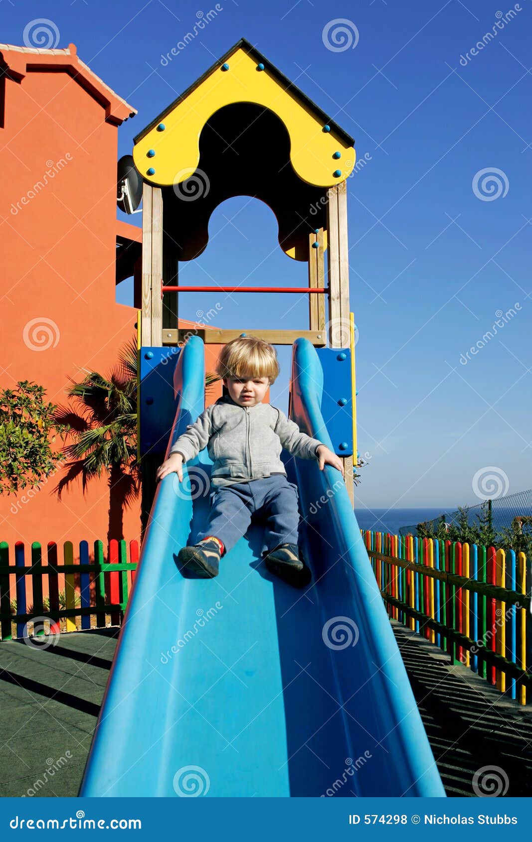 people playing on tjhe slideas people playing on tjhe slideas