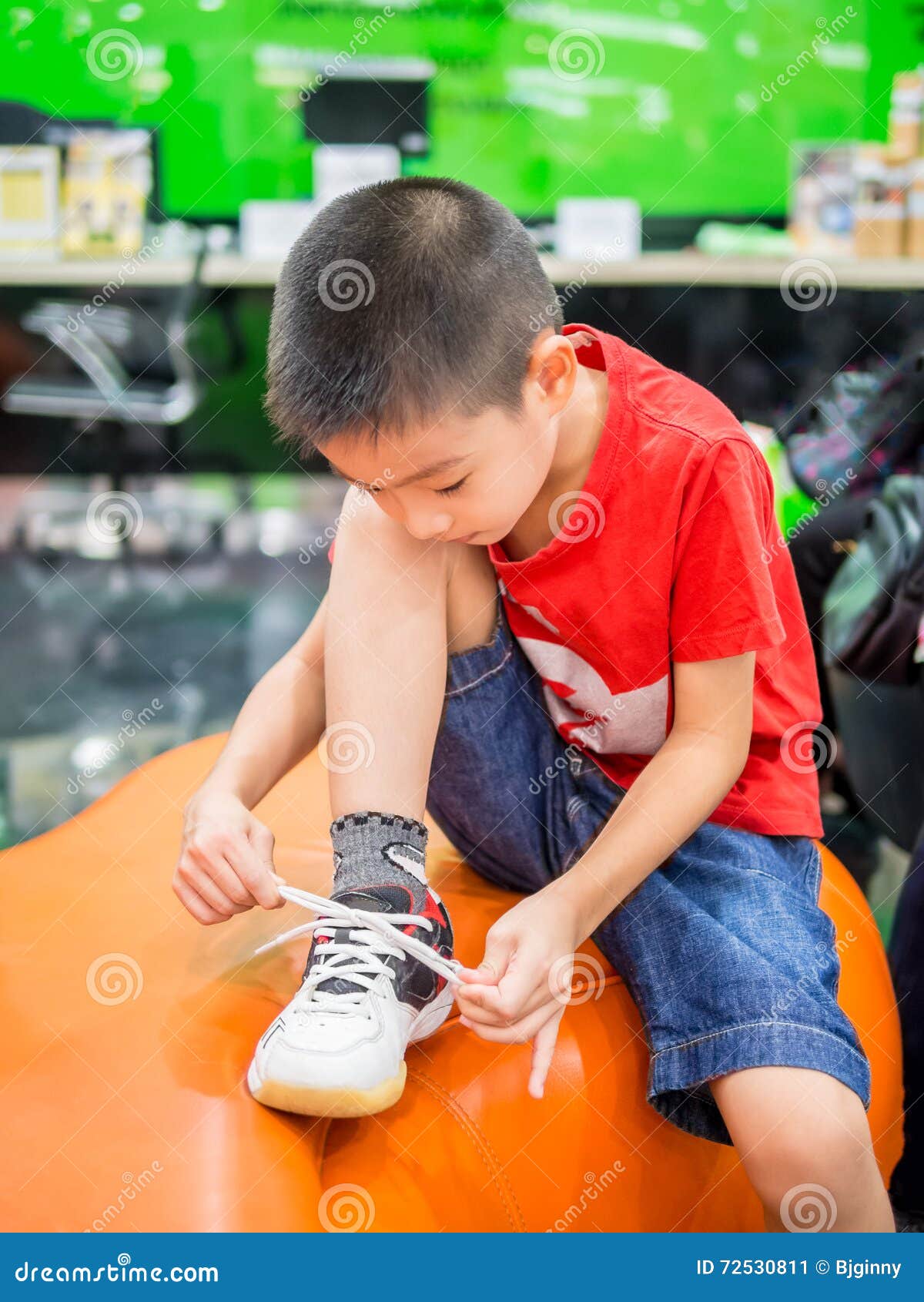 Young boy tying shoelace stock image. Image of sneakers 72530811