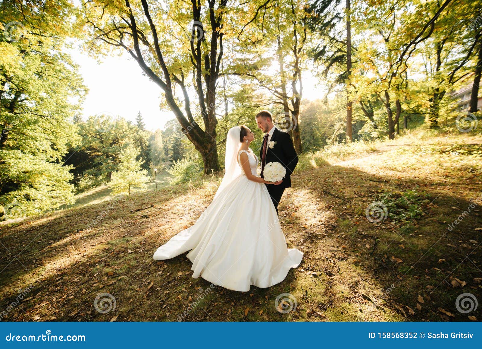 Young Bride With Groom Walking In The Forest Woman With Long