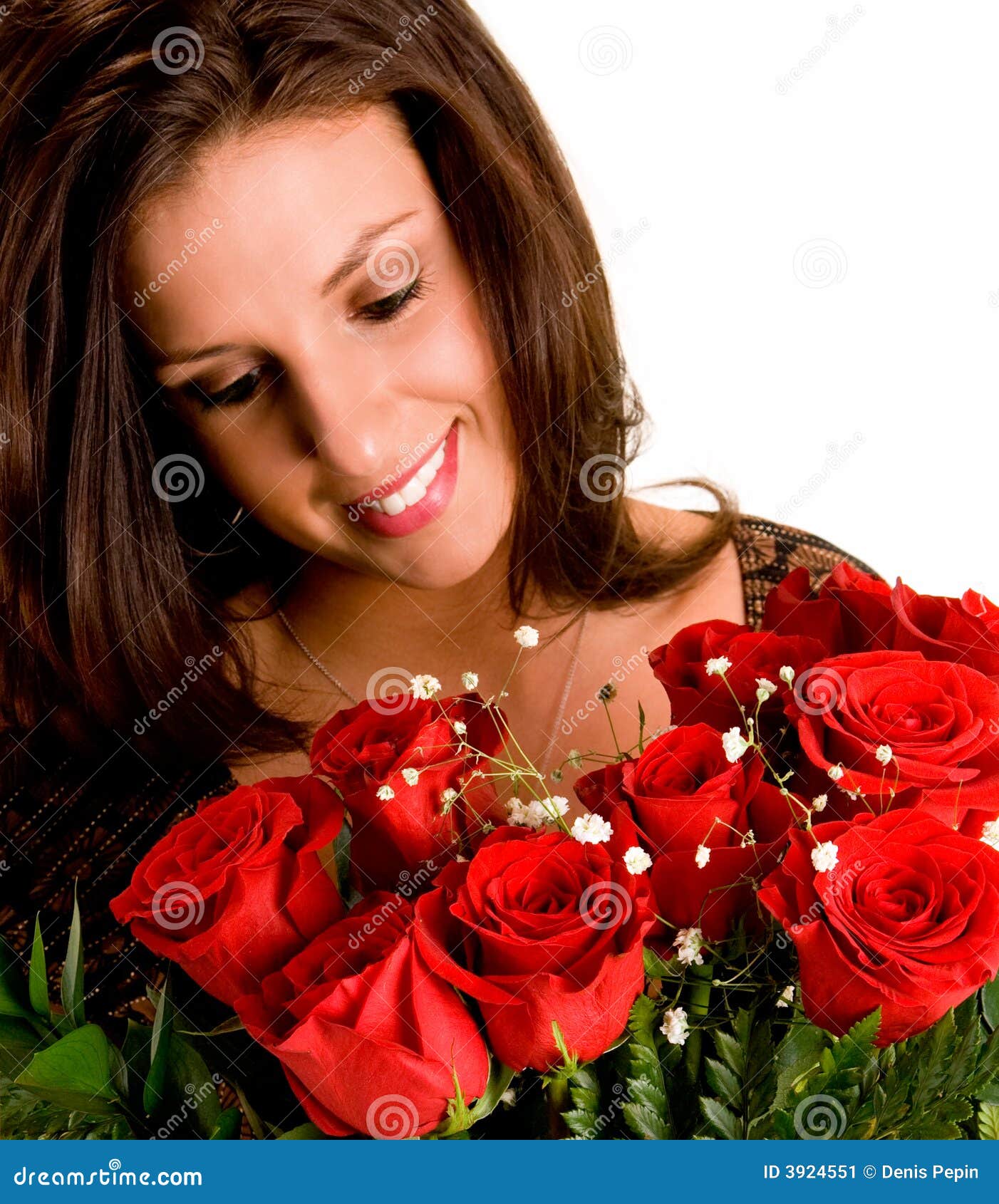 young brunette admiring her roses