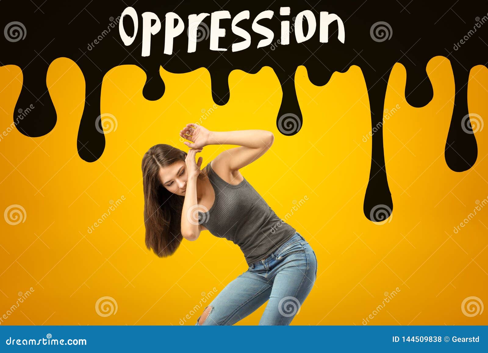 young brunette girl wearing casual jeans and t-shirt protecting herself with hands from black oppression sign on yellow