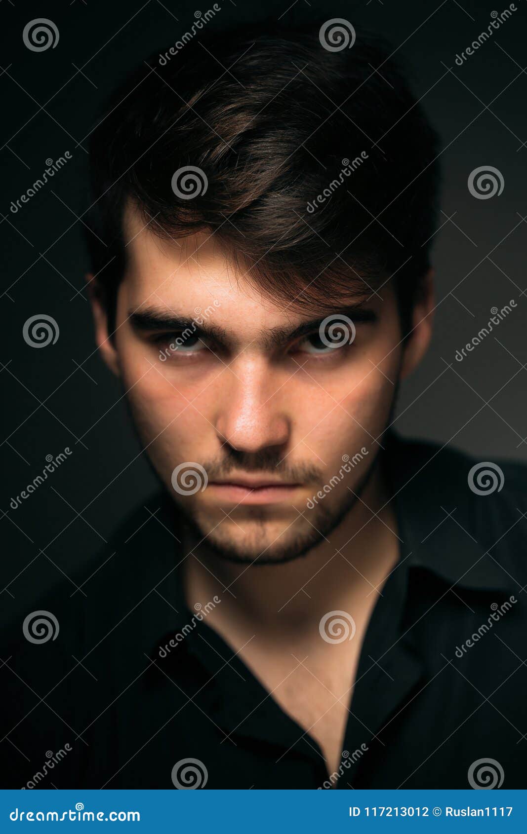 Young Brunette Guy on a Dark Background Stock Photo - Image of hair ...