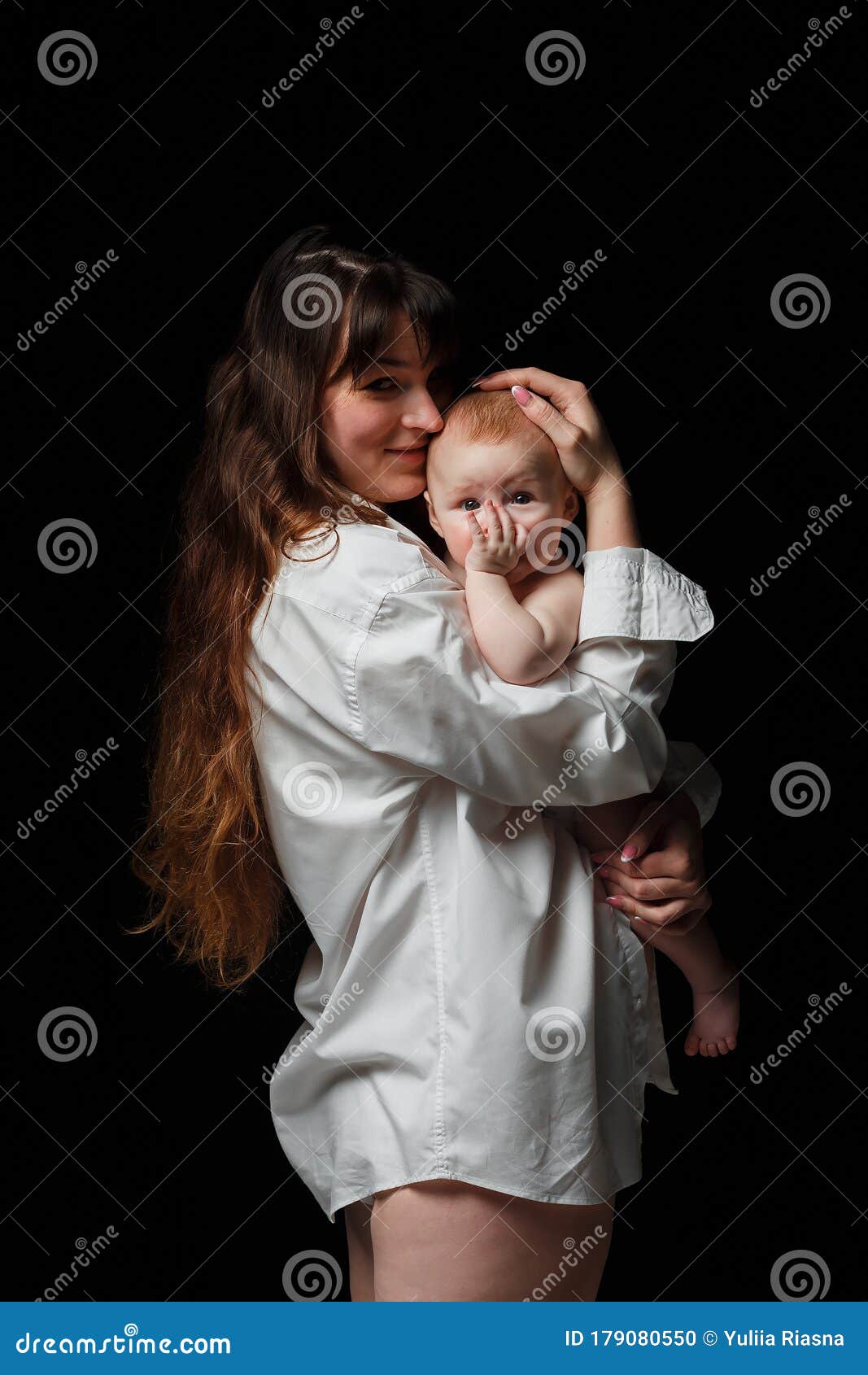 Young Brunette Mom with Long Hair and a White Shirt Holds a Newborn Son. on  a Black Background Stock Photo - Image of adorable, holding: 179080550
