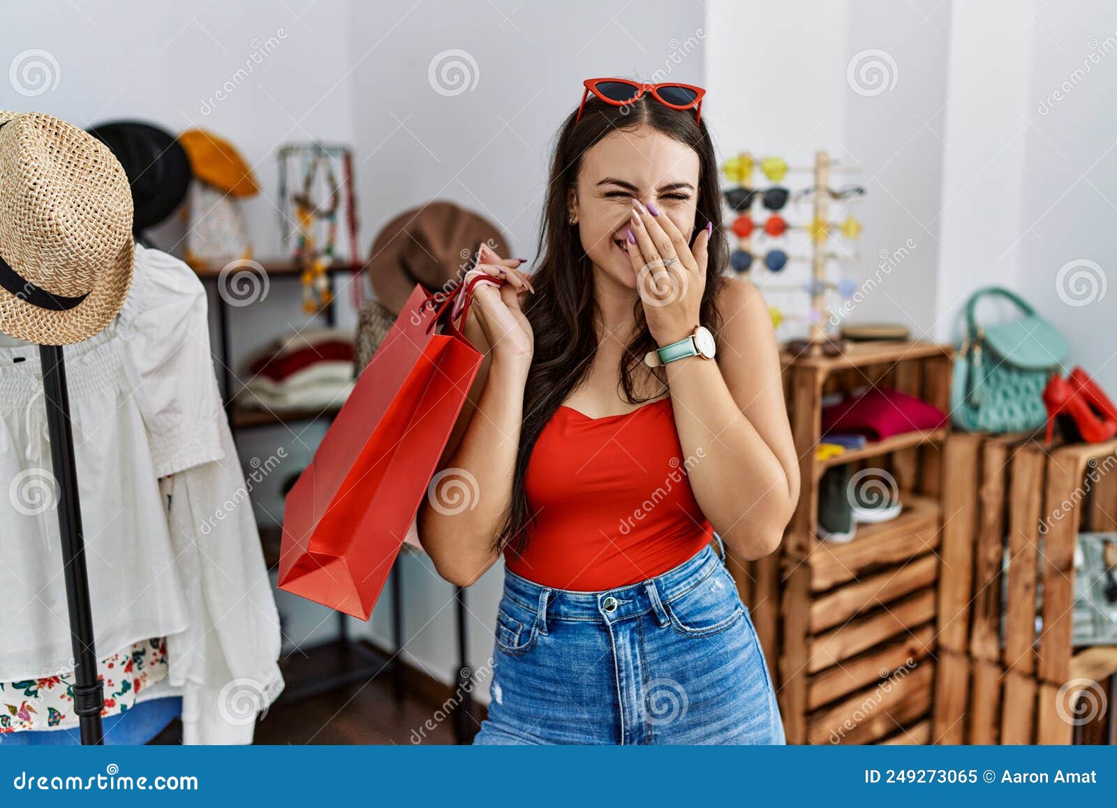 Young Brunette Woman Holding Shopping Bags at Retail Shop Laughing and ...