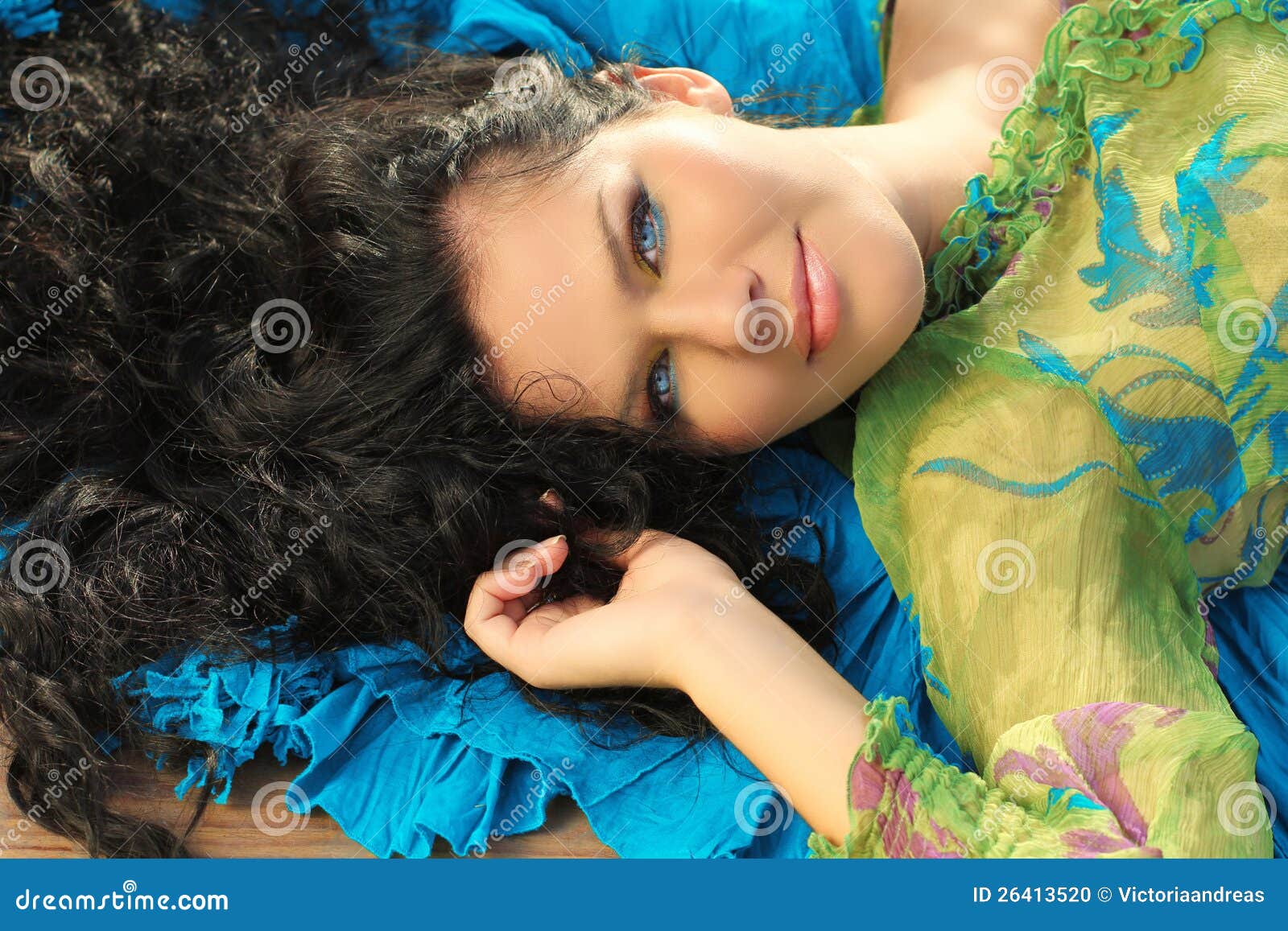 young brunette woman lying