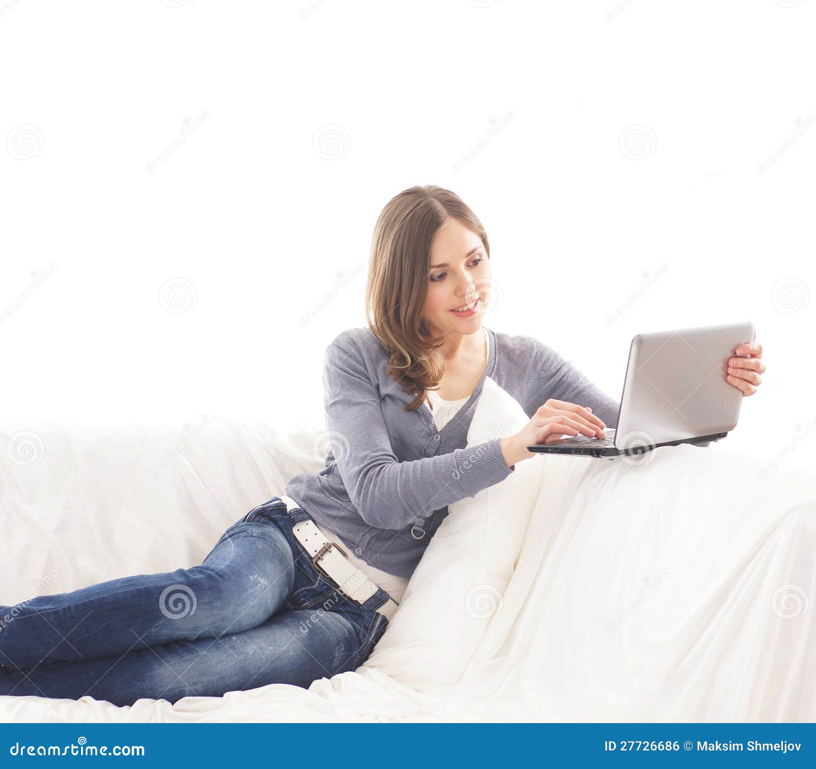 A Young Brunette Woman Working on the Laptop Stock Photo - Image of ...