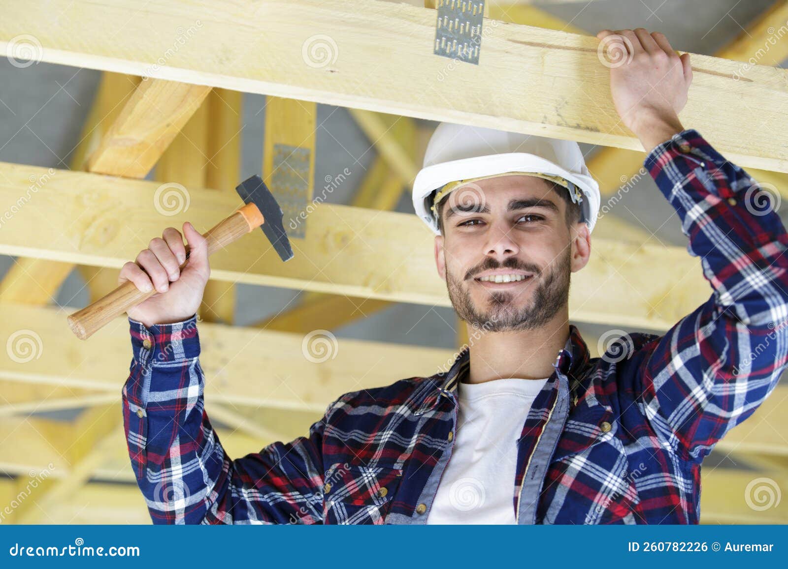 Young builder with hammer stock photo. Image of design 260782226