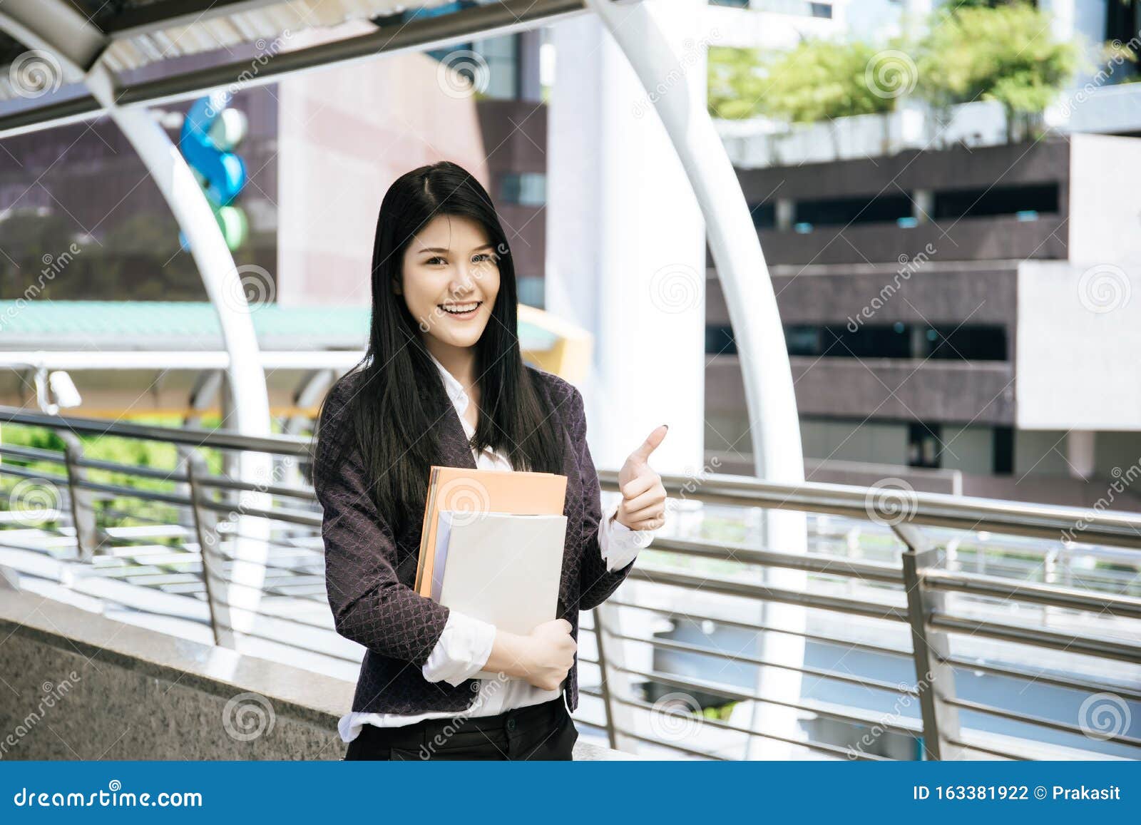 Young Business Woman Holding Reports . Stock Photo Image of holding