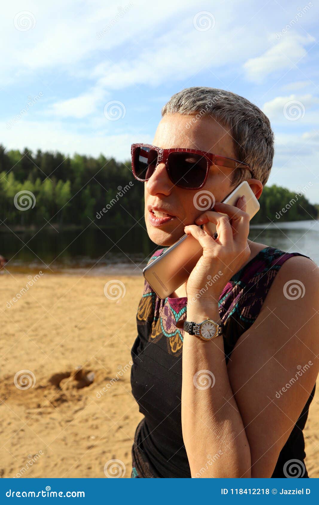 Young Business Woman Wearing Sunglasses Talking On The Mobile Phone
