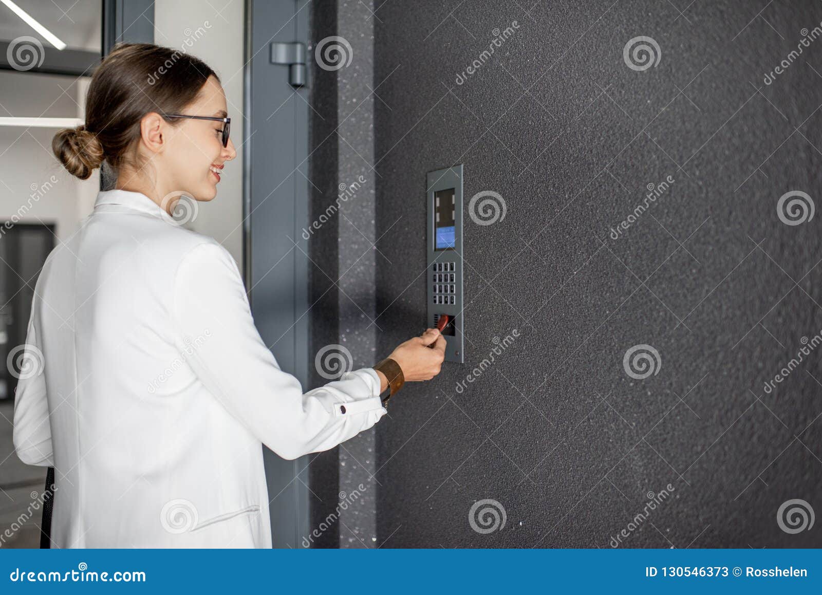 woman opening the door with keychain