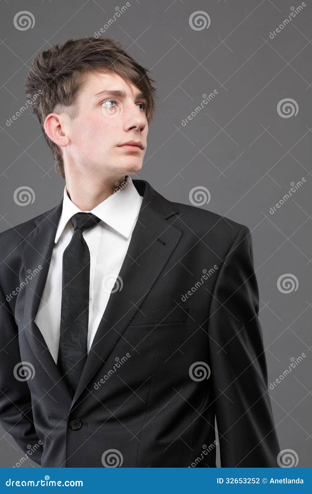 Young Businessman Black Suit Casual Tie On Gray Background Stock