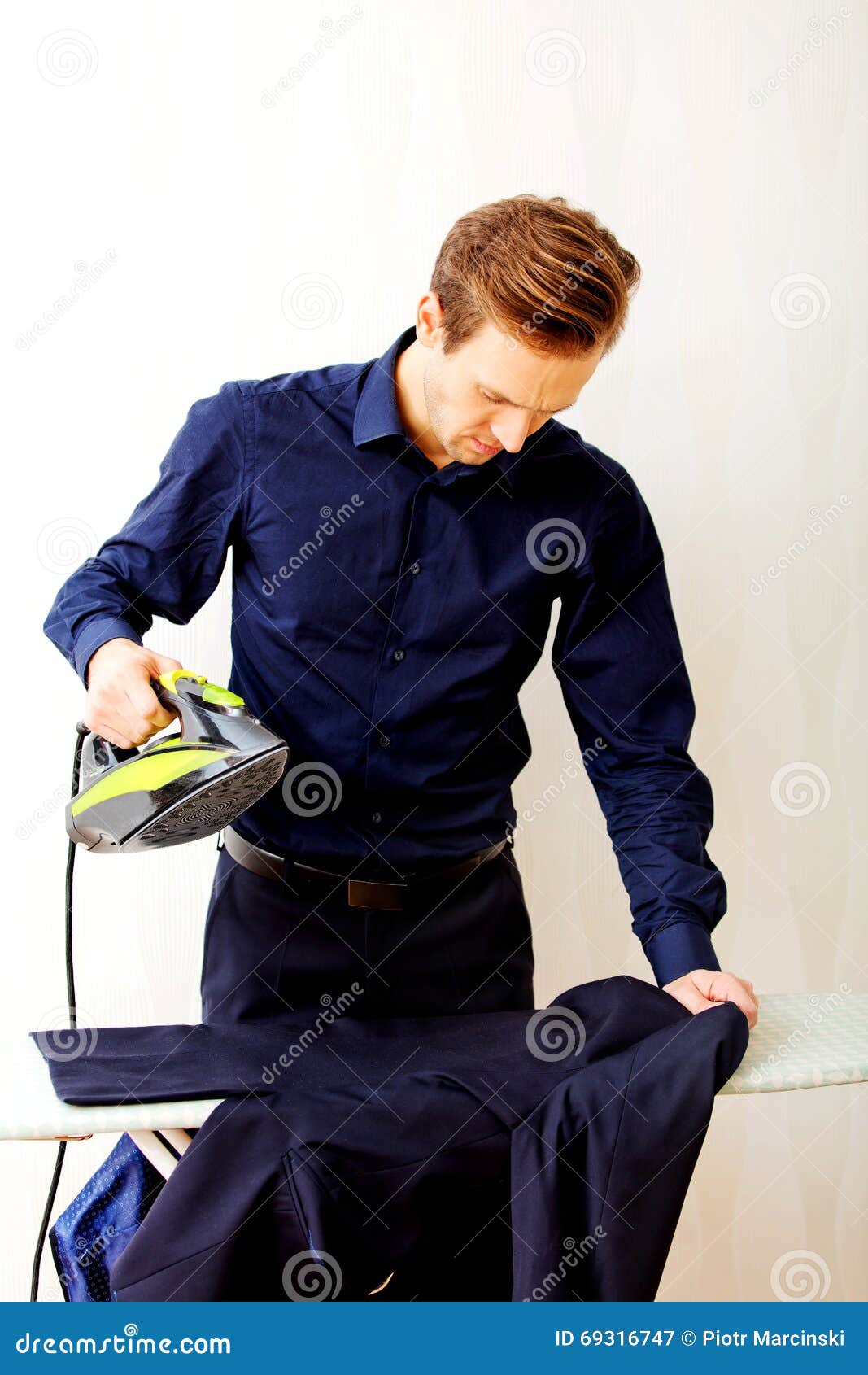 Young Businessman Ironing His Jacket Stock Image Image of male