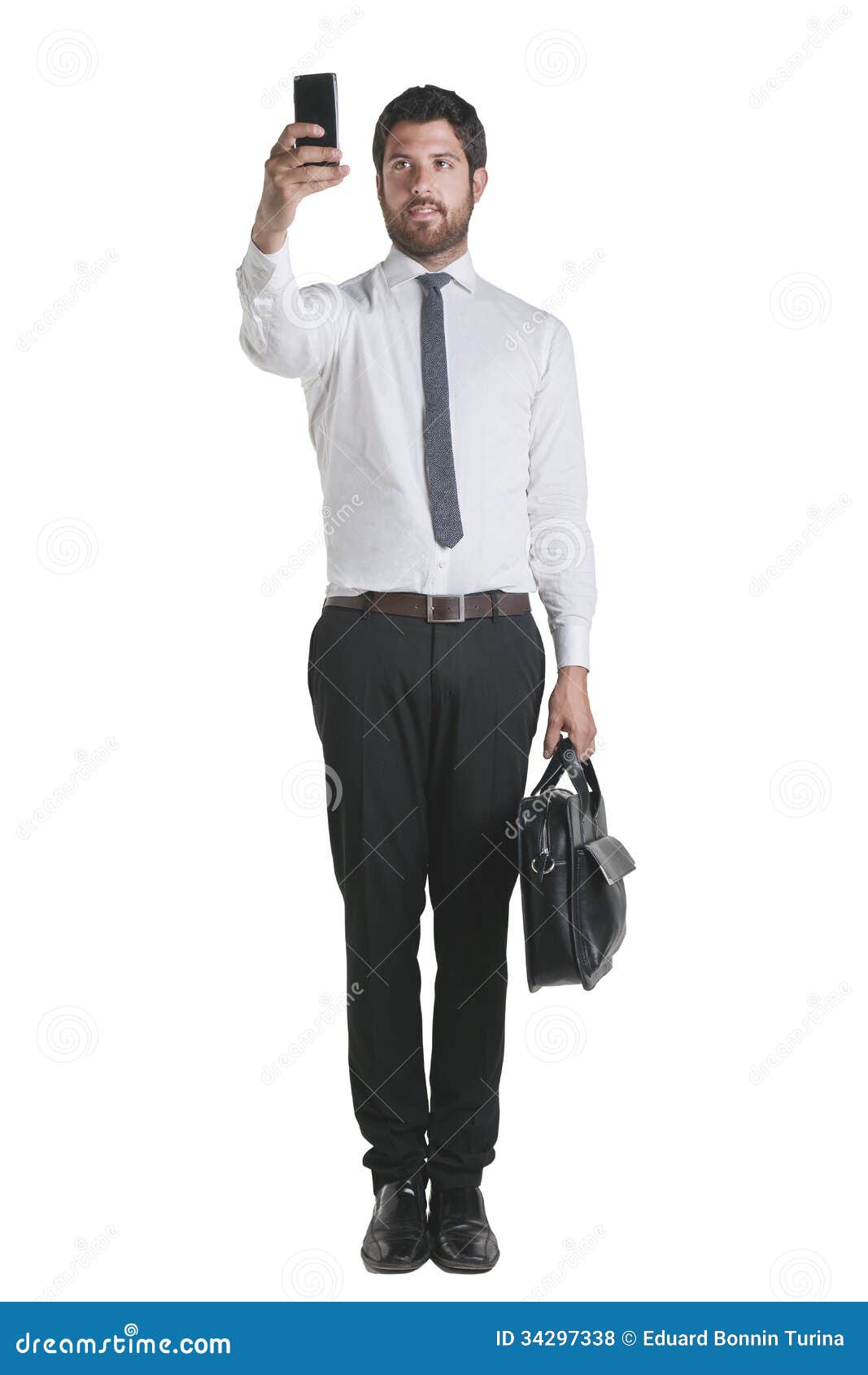 Young Businessman Standing with Briefcase and Working with Smartphone
