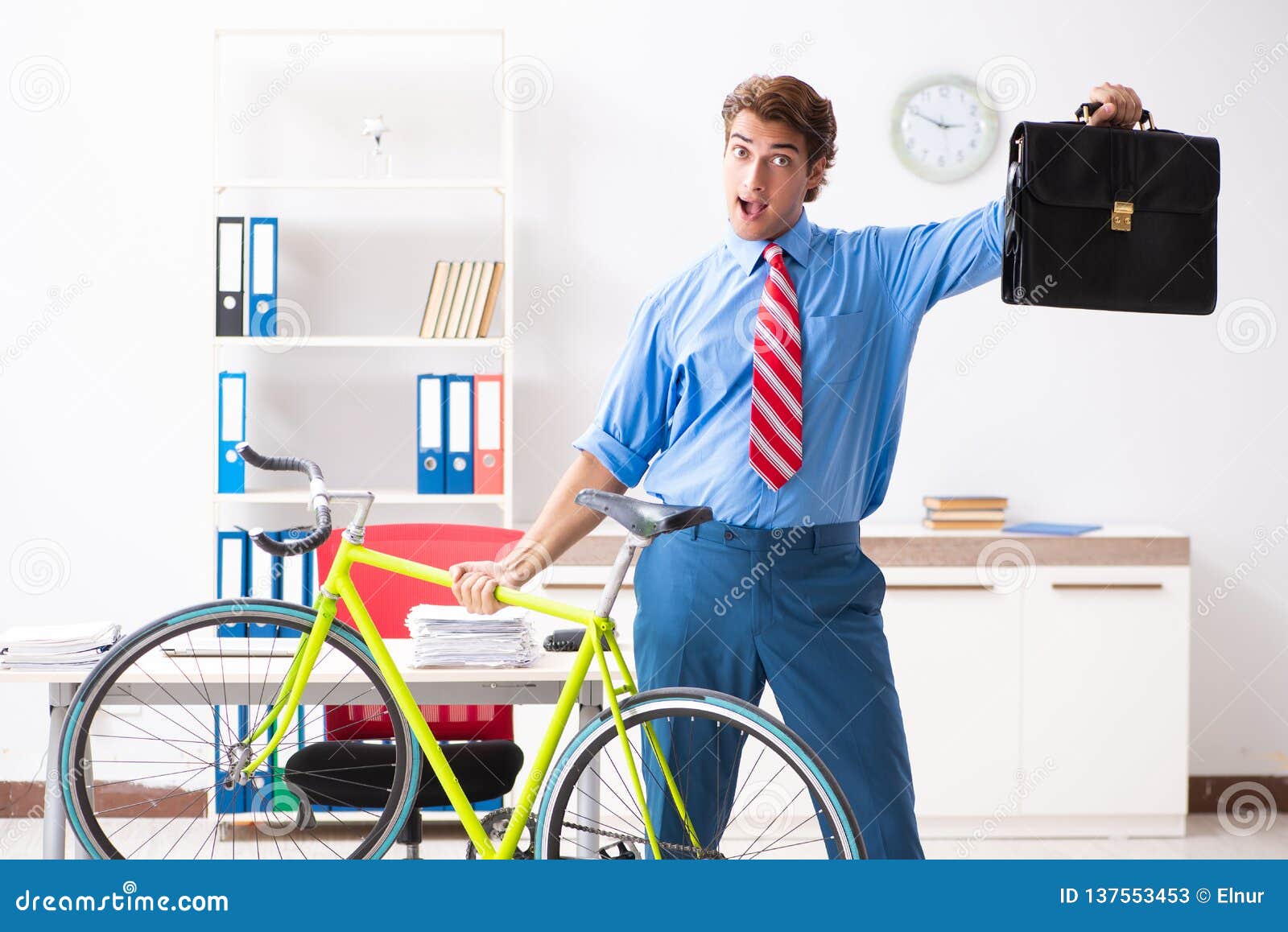 The Young Businessman Using Bike To Commute To the Office Stock Image