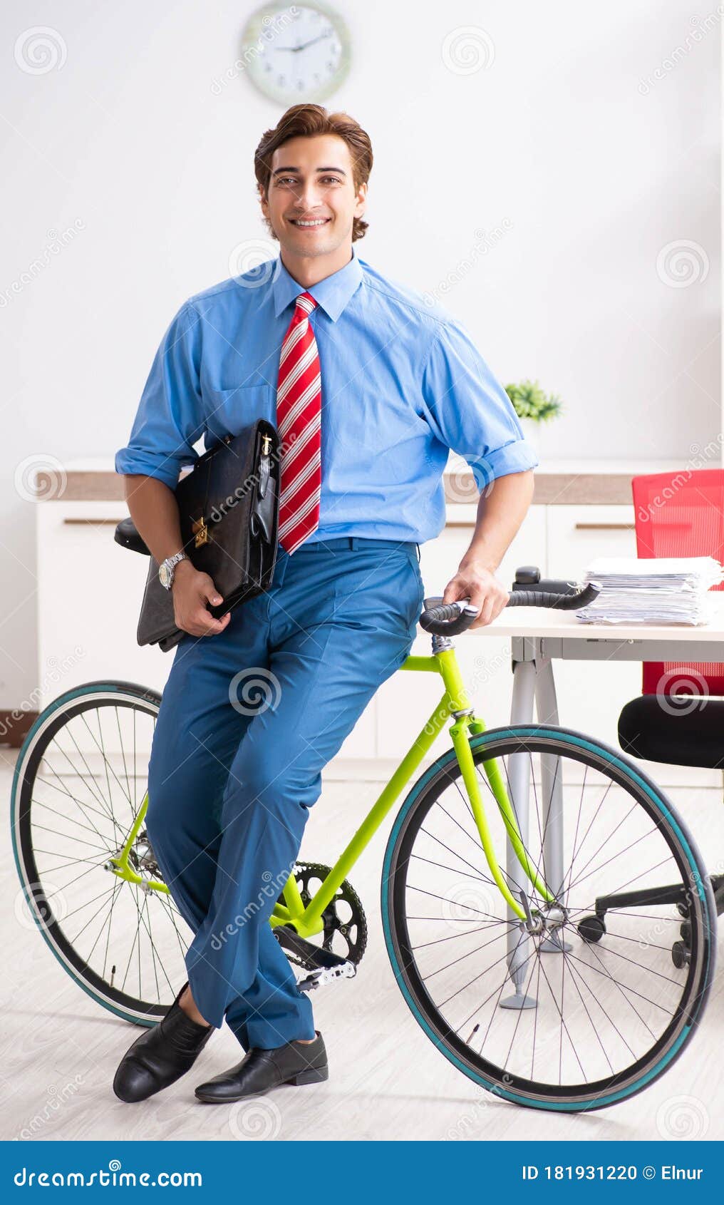 Young Businessman Using Bike To Commute To the Office Stock Photo