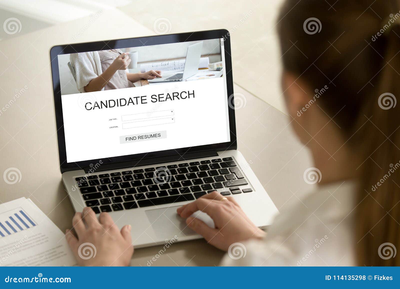 young businesswoman searching for job candidate on laptop.