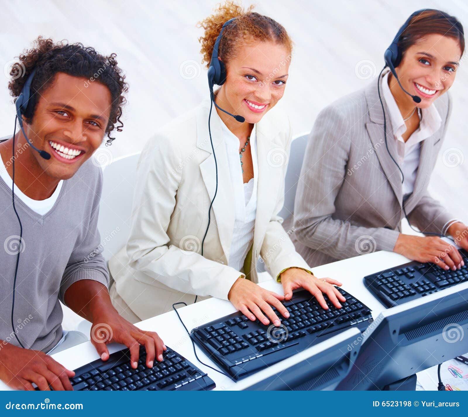 Young Call Desk Operators Using Computers Stock Photo Image of happy