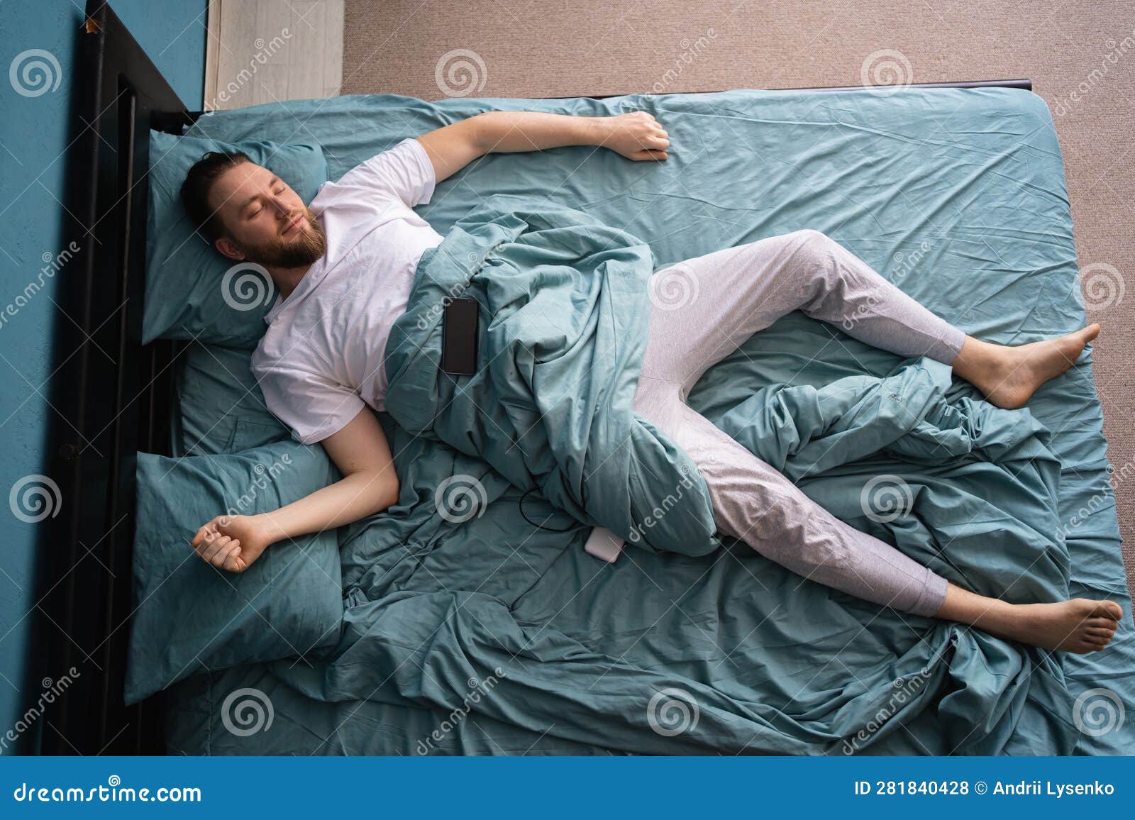 Young Caucasian Handsome Man Sleeping Spread Out in Bed with His ...