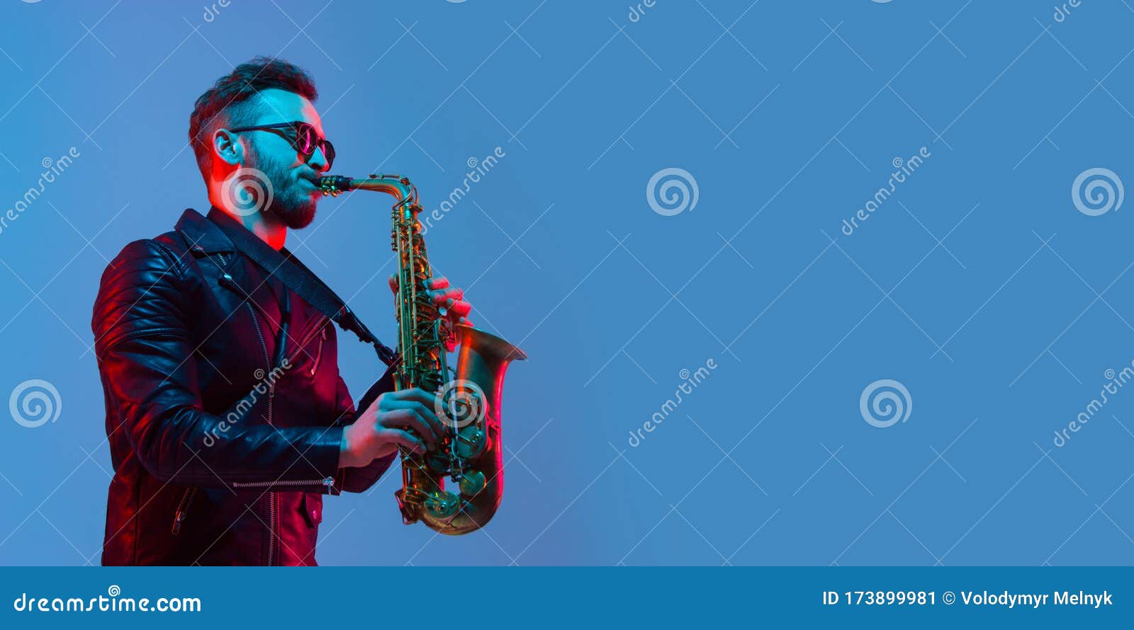 young caucasian jazz musician playing the saxophone in neon light, flyer