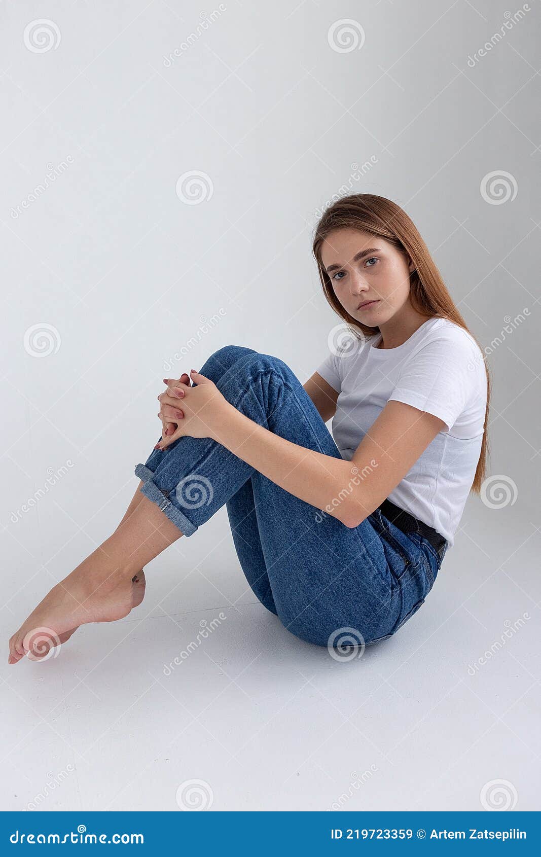 Young Caucasian Pretty Girl with Long Hair in T-shirt, Blue Jeans at ...