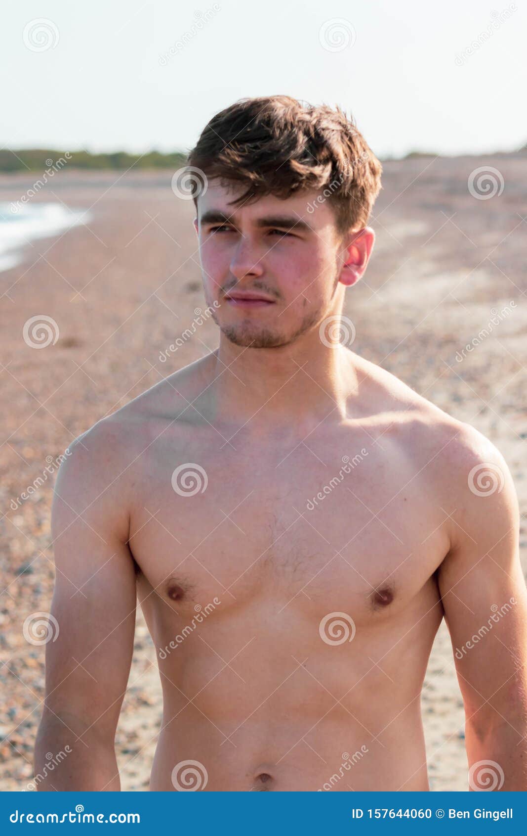 Shirtless on a beach stock photo. Image of walking, coast - 157644060