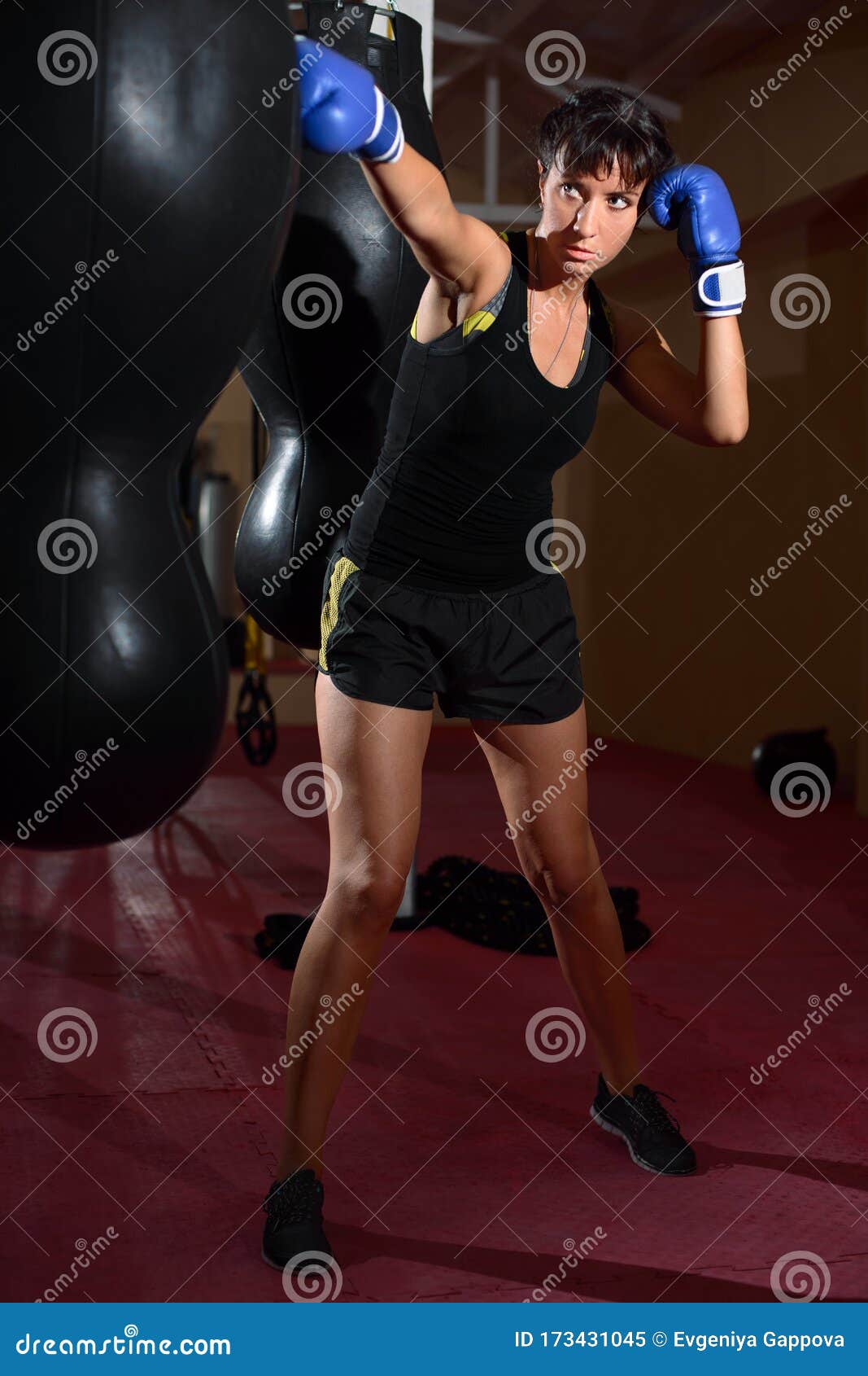 Download A Young Caucasian Woman Actively Trains In The Gym And Do ...