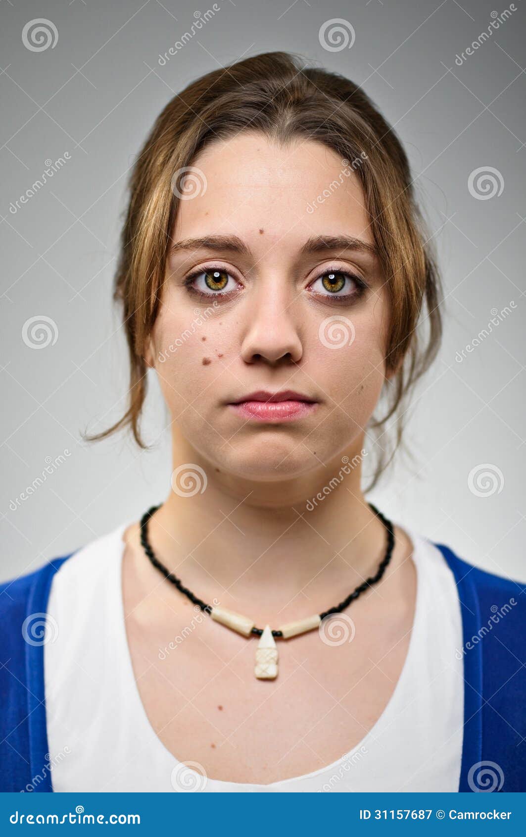 young caucasian woman blank expresion